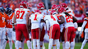 Members of the Kansas City Chiefs offensive squad huddle in the second quarter against the Denver Broncos at Empower Field at Mile High. Mandatory Credit: Ron Chenoy-Imagn Images