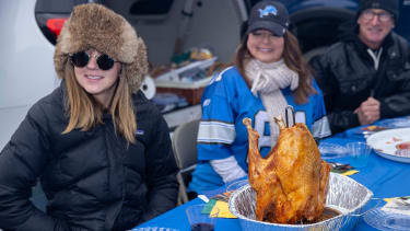 Nov 23, 2023; Detroit, Michigan, USA; Fans enjoy their pre-game turkey dinner before the annual Thanksgiving Day game between the Detroit Lions and the Green Bay Packers at Ford Field. Mandatory Credit: David Reginek-Imagn Images