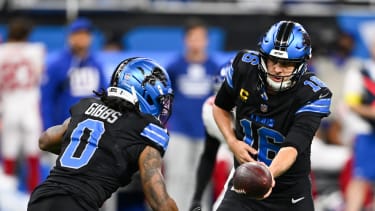Nov 23, 2025; Detroit, Michigan, USA; Detroit Lions quarterback Jared Goff (16) hands the ball off to running back Jahmyr Gibbs (0) in the first quarter against the New York Giants at Ford Field. Mandatory Credit: Lon Horwedel-Imagn Images