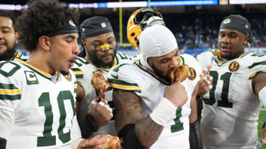 Green Bay Packers quarterback Jordan Love (10), Green Bay Packers defensive end Micah Parsons (1) and Green Bay Packers defensive tackle Warren Brinson (91)