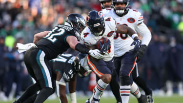 Nov 28, 2025; Philadelphia, Pennsylvania, USA; Chicago Bears running back D'Andre Swift (4) avoids a tackle by Philadelphia Eagles safety Reed Blankenship (32) during the second quarter of the game at Lincoln Financial Field. Mandatory Credit: Bill Streicher-Imagn Images
