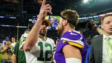 Dec 23, 2019; Minneapolis, Minnesota, USA; Green Bay Packers quarterback Aaron Rodgers (12) talks with Minnesota Vikings wide receiver Adam Thielen  (19) following a game at U.S. Bank Stadium. Mandatory Credit: Brace Hemmelgarn-Imagn Images