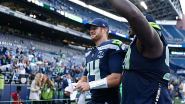 Sep 21, 2025; Seattle, Washington, USA; Seattle Seahawks quarterback Sam Darnold (14) walks off the field after the game against the New Orleans Saints at Lumen Field. Mandatory Credit: Joe Nicholson-Imagn Images