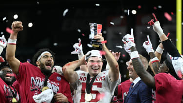 Dec 6, 2025; Indianapolis, IN, USA; Indiana Hoosiers quarterback Fernando Mendoza (15) celebrates with the MVP trophy after defeating the Ohio State Buckeyes in the 2025 Big Ten championship game at Lucas Oil Stadium. Mandatory Credit: Robert Goddin-Imagn Images
