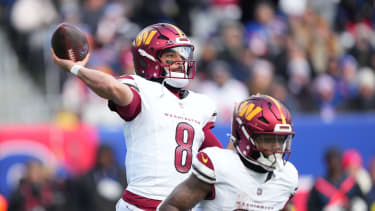 Dec 14, 2025; East Rutherford, New Jersey, USA;  Washington Commanders quarterback Marcus Mariota (8) passes the ball during the second quarter against the New York Giants at MetLife Stadium. Mandatory Credit: Robert Deutsch-Imagn Images