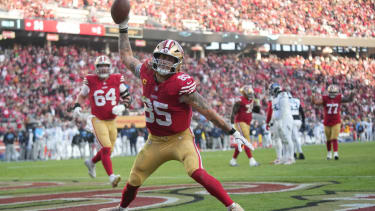 San Francisco 49ers tight end George Kittle (85) scores a touchdown