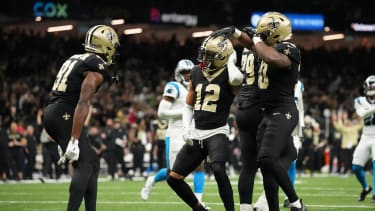Dec 14, 2025; New Orleans, Louisiana, USA; New Orleans Saints wide receiver Chris Olave (12) celebrates with teammates after scoring a touchdown in the fourth quarter against the Carolina Panthers at Caesars Superdome. Mandatory Credit: Matthew Hinton-Imagn Images