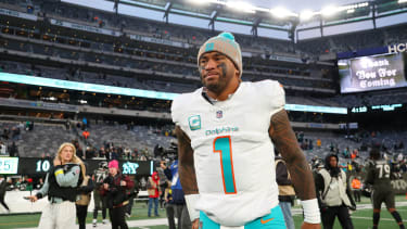 Miami Dolphins quarterback Tua Tagovailoa (1) walks on the field