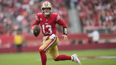San Francisco 49ers quarterback Brock Purdy (13) runs with the ball during the first quarter against the Tennessee Titans at Levi's Stadium. Mandatory Credit: Cary Edmondson-Imagn Images
