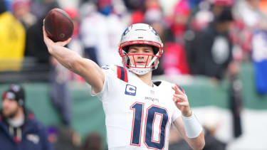New England Patriots quarterback Drake Maye (10) warms up