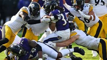 Baltimore Ravens running back Keaton Mitchell (34) is stopped by the Pittsburgh Steelers defense after a short gain during the first quarter at M&amp;T Bank Stadium in Baltimore, Maryland, on Sunday, December 7 2025. Photo by David Tulis/UPI Photo via Newscom picture alliance
